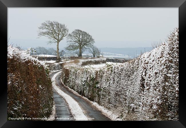 Hill top lane in snow Framed Print by Pete Hemington