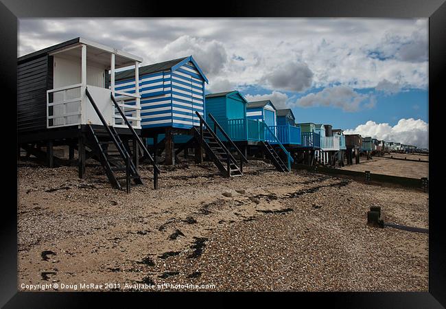 Beach huts at low tide Framed Print by Doug McRae