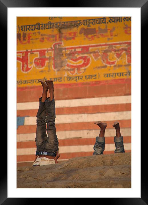 Doing Yoga on the Ghats at Varanasi Framed Mounted Print by Serena Bowles