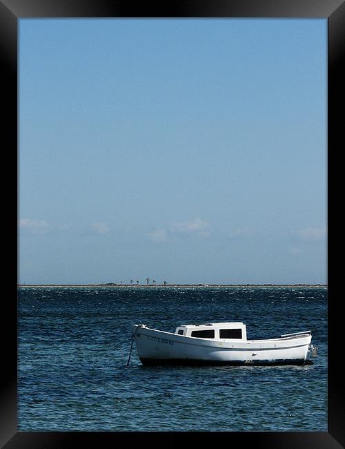 Lonely Boat Framed Print by John Basford