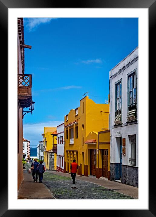 Strolling down the Street in Garachico Framed Mounted Print by Joyce Storey