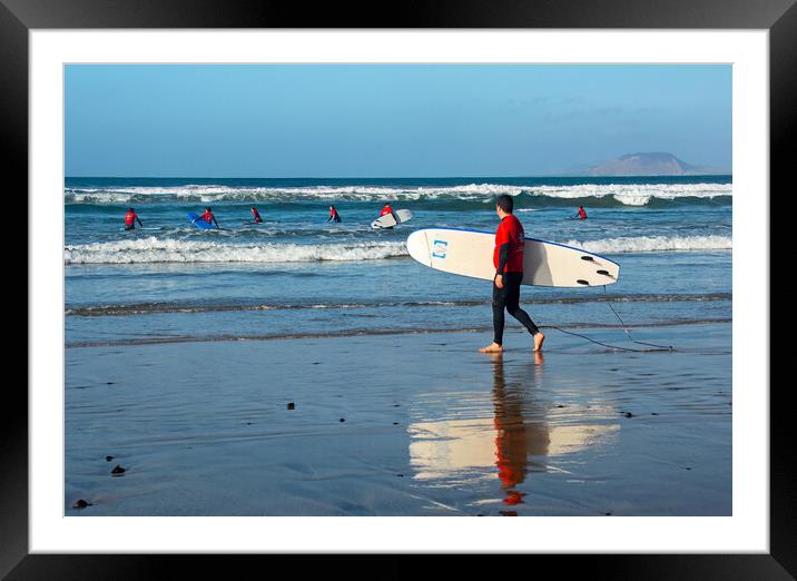Surfers on Famara Beach Framed Mounted Print by Joyce Storey