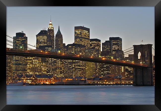 Manhattan at sunset Framed Print by Thomas Stroehle