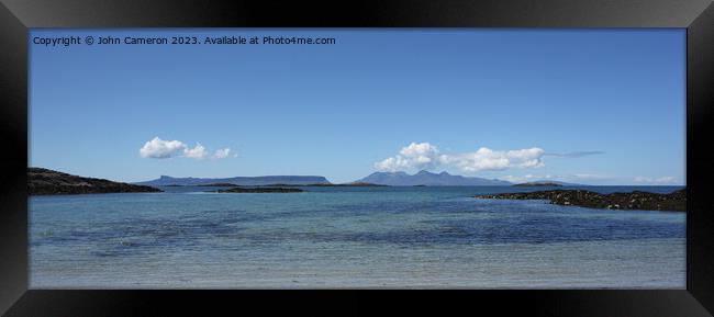 Eigg and Rum from Traigh. Framed Print by John Cameron