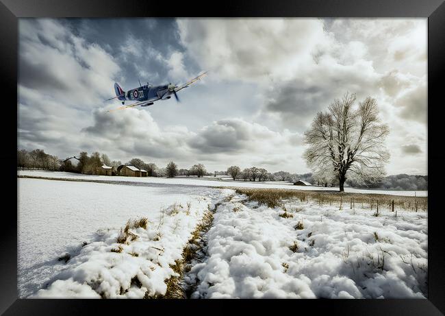 Spitfire Snowbound Framed Print by J Biggadike