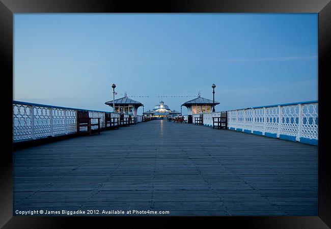 A Walk Down The Pier Framed Print by J Biggadike
