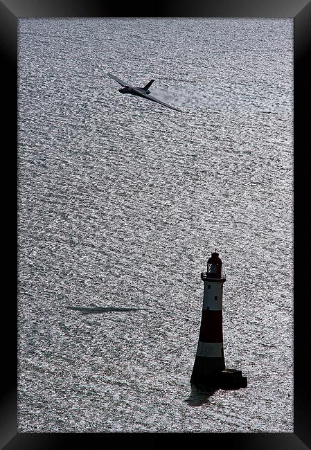 XH558 Over The Lighthouse Framed Print by J Biggadike