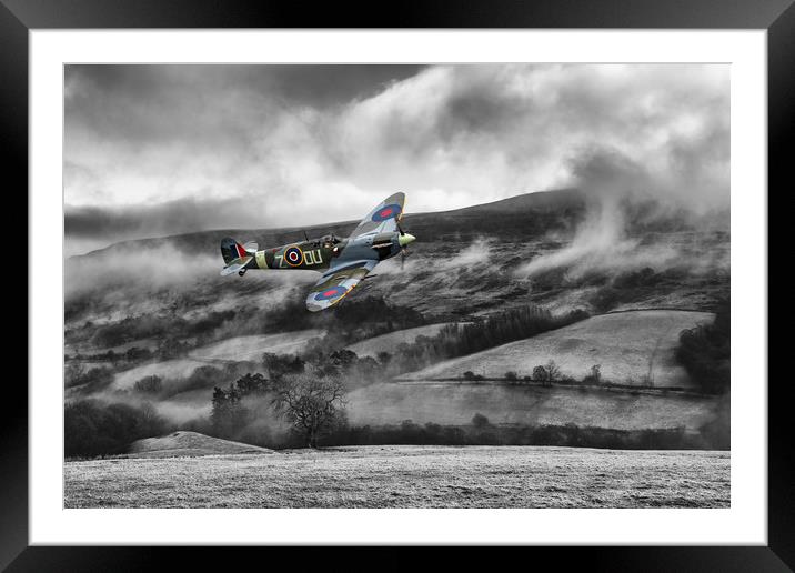 Spitfire Low Cloud Framed Mounted Print by J Biggadike