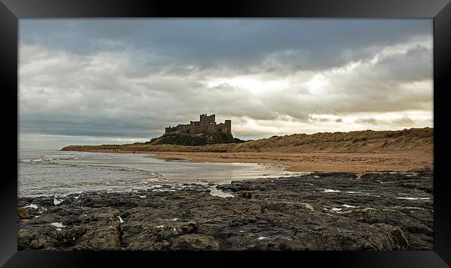 Bamburgh Castle Framed Print by John Biggadike