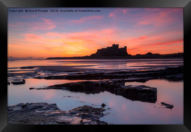 Bamburgh Castle at Sunrise Framed Print by David Pringle