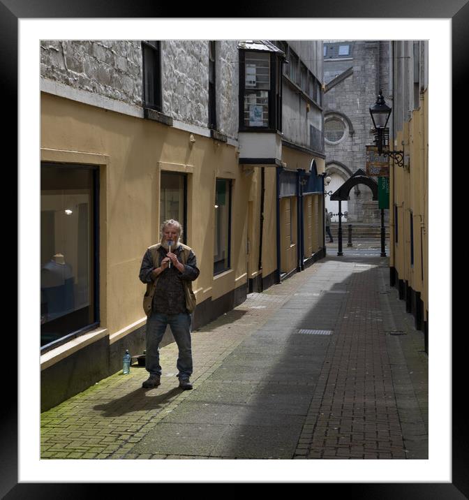 Flautist busking on the streets of Galway Framed Mounted Print by Rory Trappe