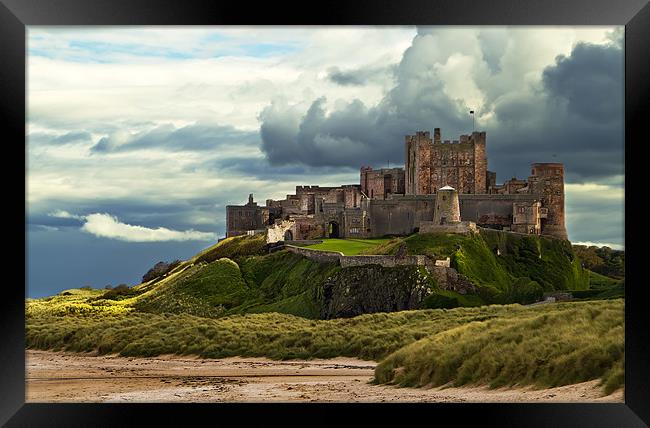 Cloudy Bamburgh Castle Framed Print by Kevin Tate