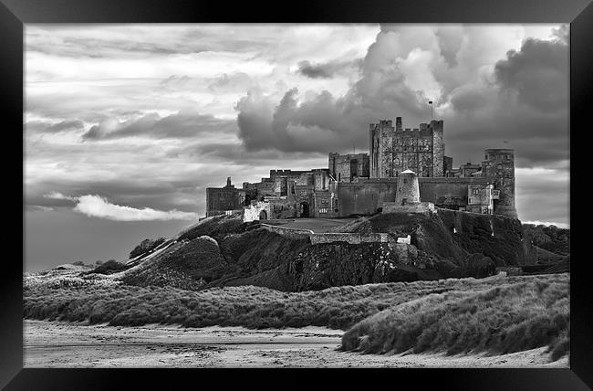 Cloudy Bamburgh Castle Framed Print by Kevin Tate