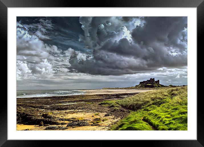 Dramatic skys over Bamburgh Castle and beach Framed Mounted Print by Kevin Tate