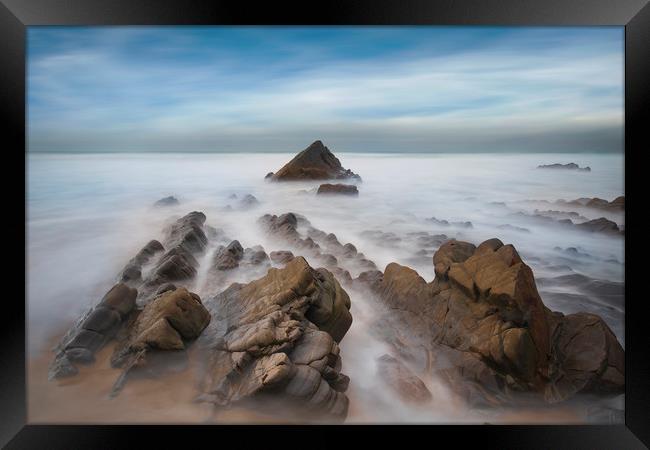 jagged rocks and smooth sea's at Sandymouth beach Framed Print by Eddie John