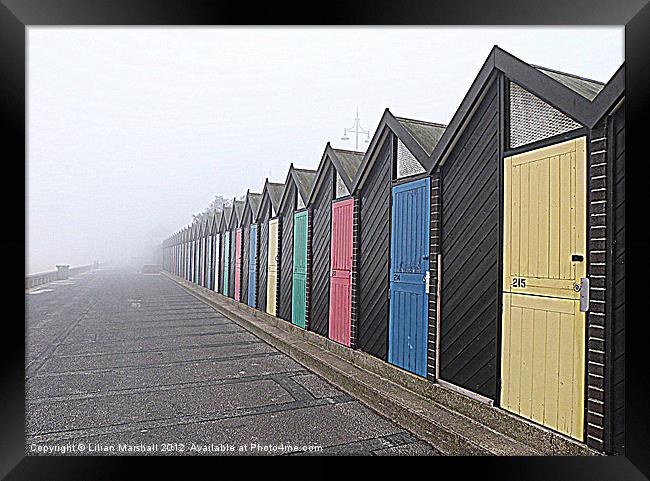 Beach Huts in the fog. Framed Print by Lilian Marshall