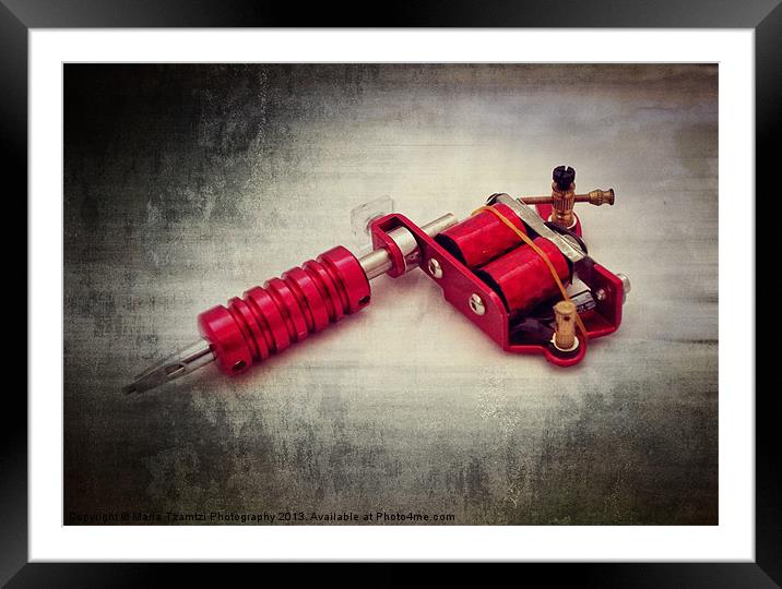 Red tattoo gun Framed Mounted Print by Maria Tzamtzi Photography
