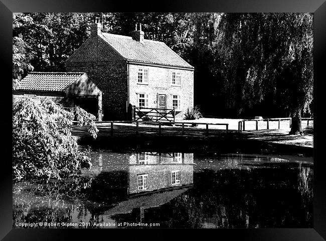 The Village pond in reflective mood. Framed Print by Robert Gipson