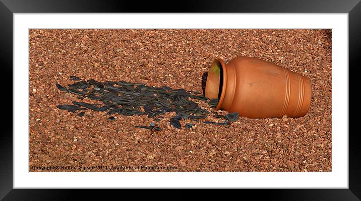 Clay pot tips up Framed Mounted Print by Robert Gipson