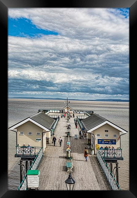 Looking Down The Pier 3 Framed Print by Steve Purnell