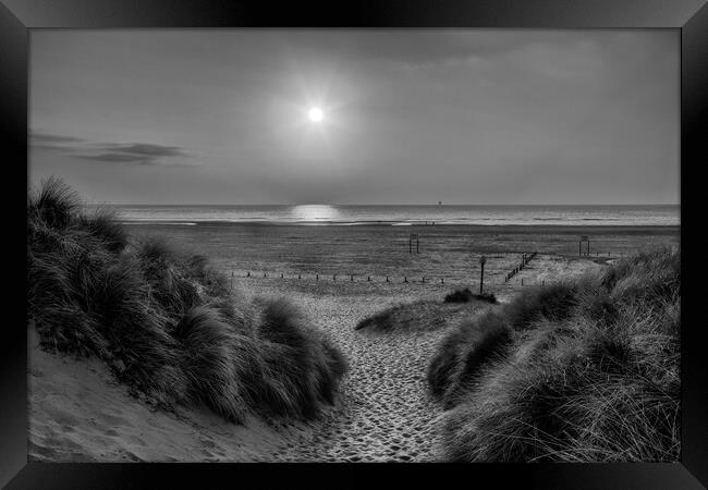 Sunset Through The Dunes Framed Print by Roger Green