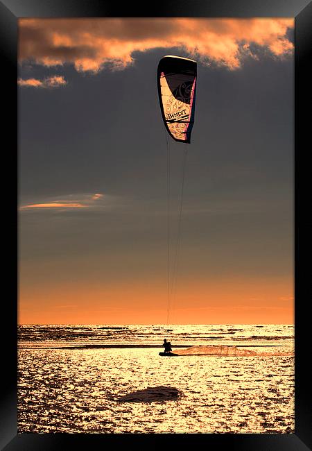 Kitesurfing at Sunset Framed Print by Roger Green