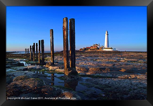 St. Mary's Lighthouse, sunset. Framed Print by Michael Oakes