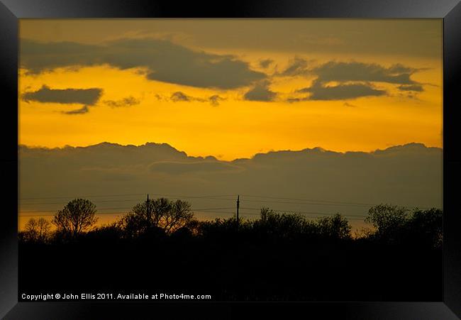Sunset over Woolsington Framed Print by John Ellis