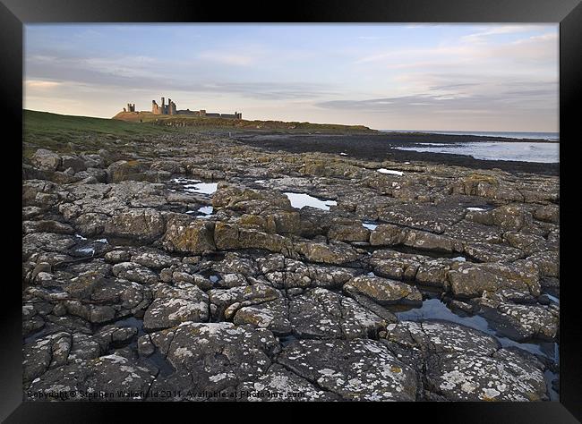 Dunstanburgh castle and coast Framed Print by Stephen Wakefield