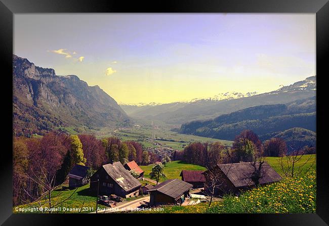 Sleepy Swiss Village looking toward Vaduz Framed Print by Russell Deaney
