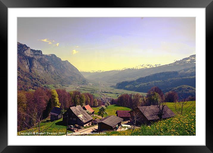 Sleepy Swiss Village looking toward Vaduz Framed Mounted Print by Russell Deaney