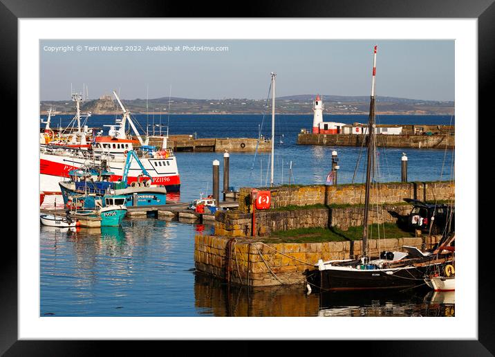 Newlyn South Pier Lighthouse and St Michael's Mount Framed Mounted Print by Terri Waters