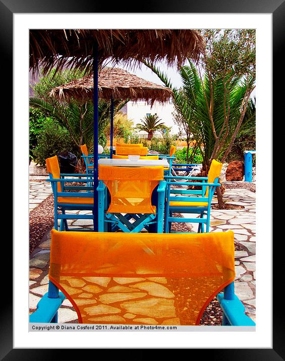 Santorini Yellow Chairs Framed Mounted Print by DEE- Diana Cosford