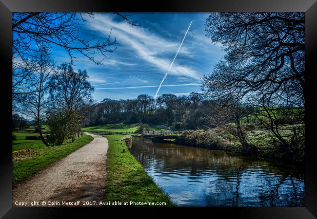 Vapour trails over the canal. Framed Print by Colin Metcalf