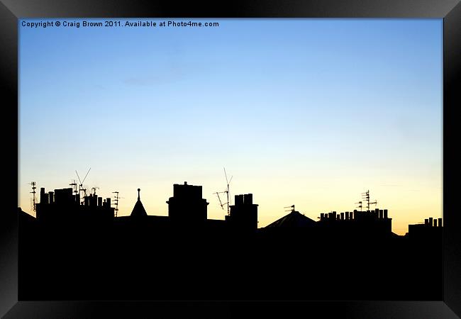 Silhouetted Rooftops at Dusk Framed Print by Craig Brown