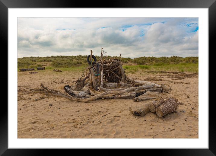 Driftwood beach hut Framed Mounted Print by Gary Eason