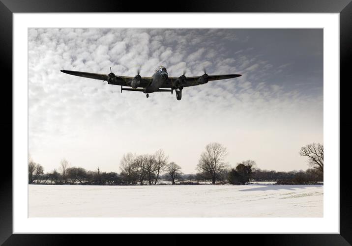 Nearly home - Lancaster limping back in winter Framed Mounted Print by Gary Eason