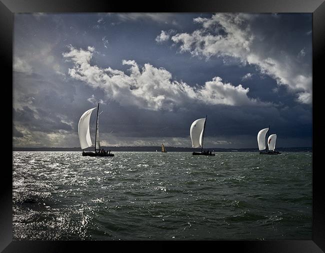 Yachts racing into the light Framed Print by Gary Eason