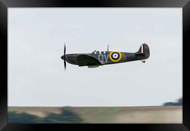 Spitfire low-level flying Framed Print by Gary Eason