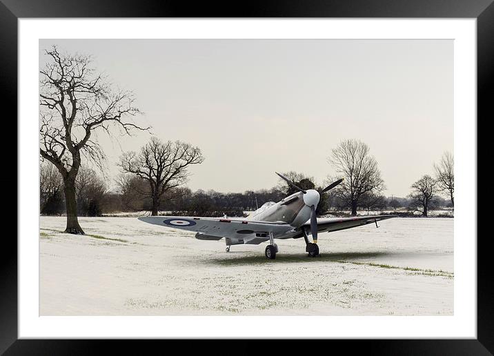 Spitfire in the snow Framed Mounted Print by Gary Eason