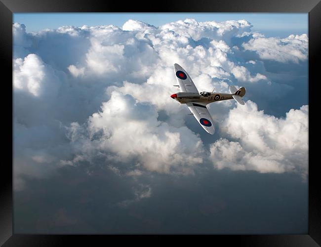 Soaring silver Spitfire cloudscape Framed Print by Gary Eason
