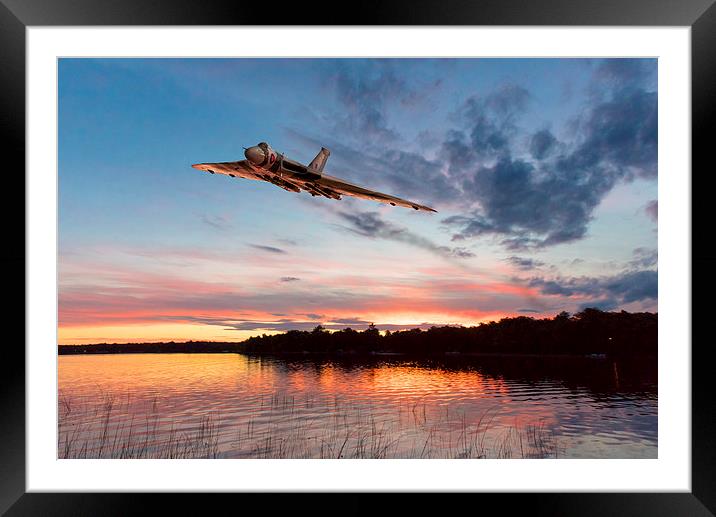 Vulcan low over a sunset lake Framed Mounted Print by Gary Eason