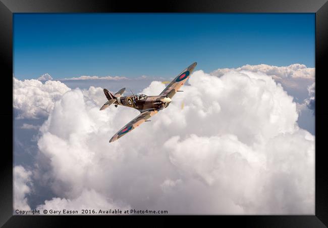 Spitfire above clouds Framed Print by Gary Eason