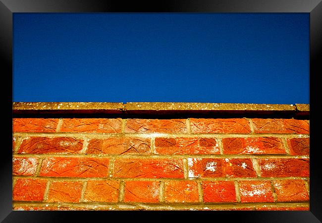 Brick Meets Sky Framed Print by Caroline Williams