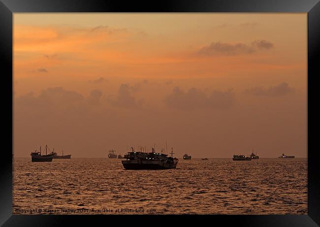 boats in sunset Framed Print by Hassan Najmy