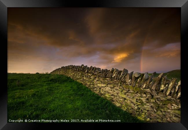 A stone wall and rainbow Framed Print by Creative Photography Wales