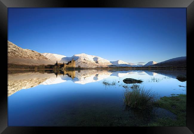 Kilchurn Castle reflecting on Loch Awe in Winter Framed Print by Maria Gaellman