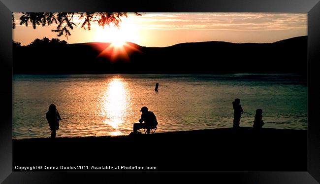 Fishing at sunset Framed Print by Donna Duclos