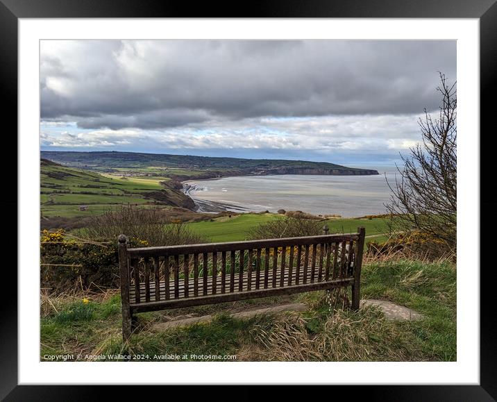 Bench with a view of Robin Hoods Bay Framed Mounted Print by Angela Wallace