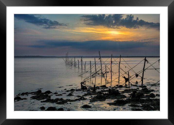 Fishing nets at Sunset Framed Mounted Print by Derek Beattie